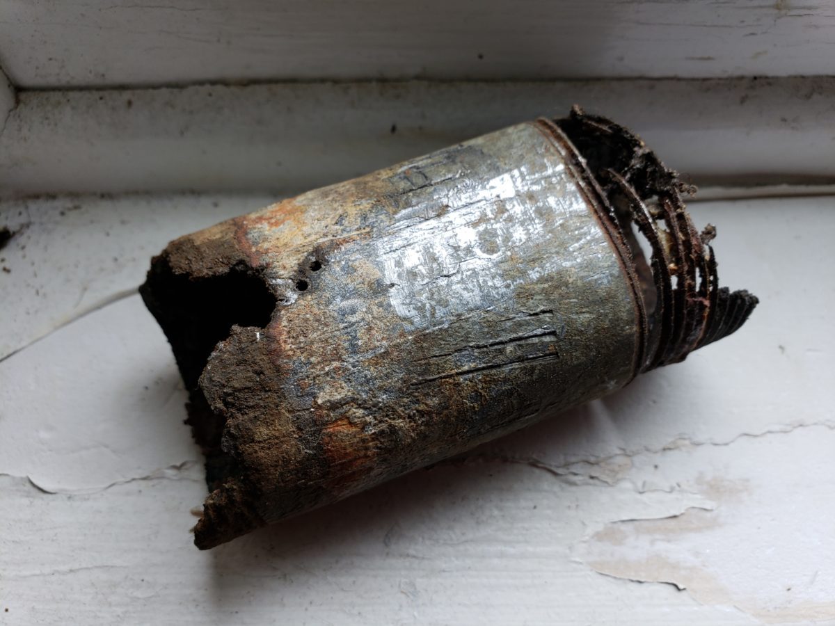 A close up of an old metal can