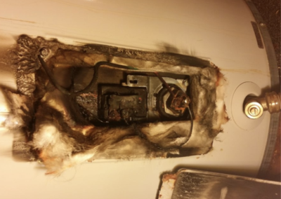 A burnt water heater thermostat by Cinch Mechanical